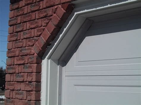Garage door weather stripping on door jamb — illustrative of option and installation